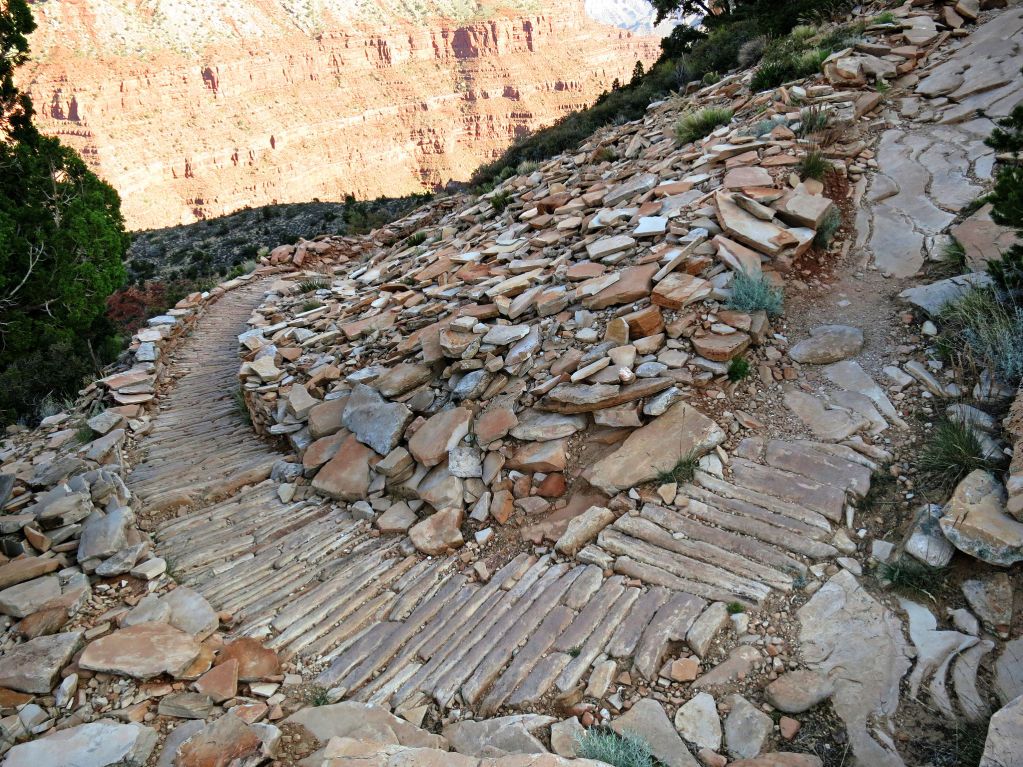 intricately-built rock trail winding downhill