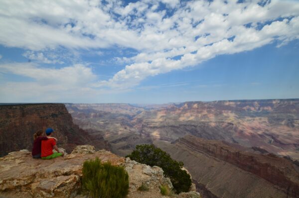 couple sitting next to each other during a grand canyon hike