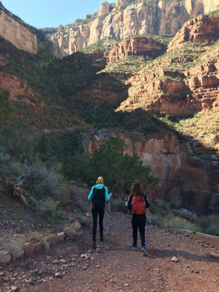 two people hiking in the grand canyon