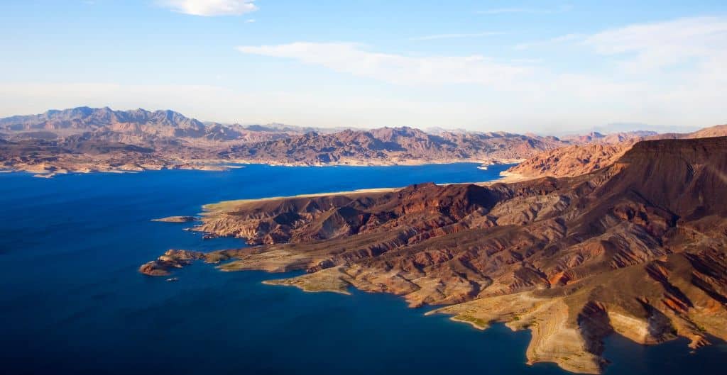 looking down at the bright blue water of Lake Mead from above